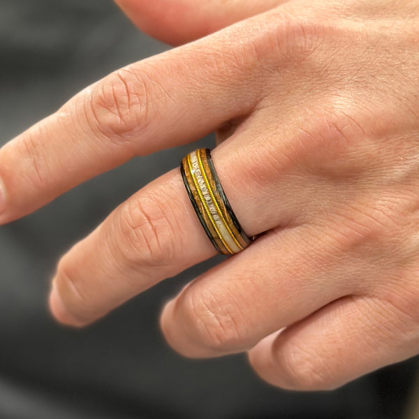 Beautiful Polished Black Tungsten Low Dome Ring with Deer Antler Inlay Between Two Cool Genuine Guitar Strings Surrounded By Whiskey Barrel Oak Wood Inlays.