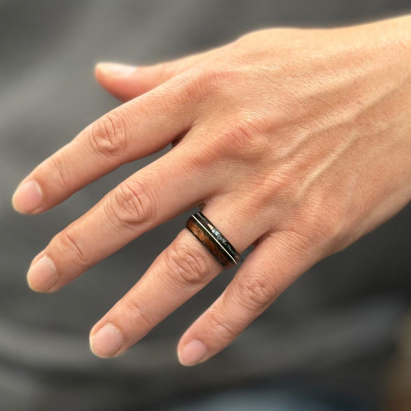 Cool Polished Black Tungsten Low Dome Ring with Silver Guitar String Between Iridescent Abalone And Whiskey Barrel Oak Wood Inlays.