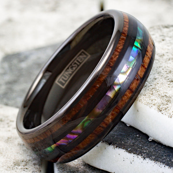 Brilliant Polished Black Tungsten Low Dome Ring with Iridescent Abalone Inlay Between Two Black Bands And Koa Wood Inlays.