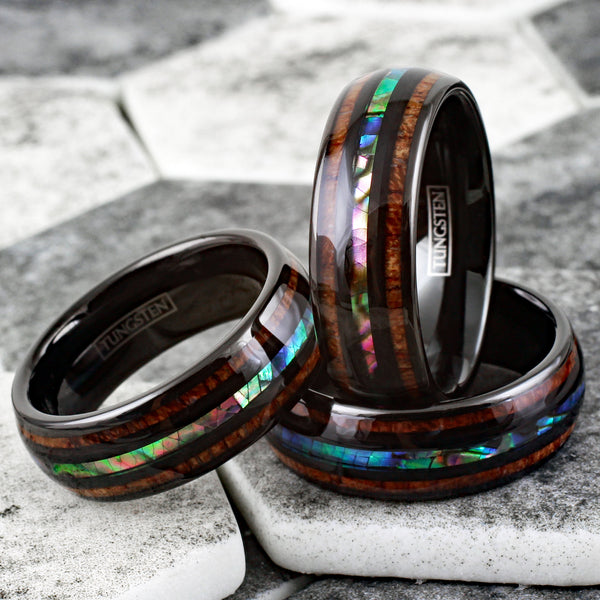 Brilliant Polished Black Tungsten Low Dome Ring with Iridescent Abalone Inlay Between Two Black Bands And Koa Wood Inlays.
