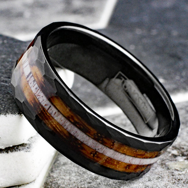 Sublime Faceted Brushed Finish Black Tungsten Flat Band Ring with Deer Antler Inlay Between Whiskey Barrel Oak Wood Inlays.