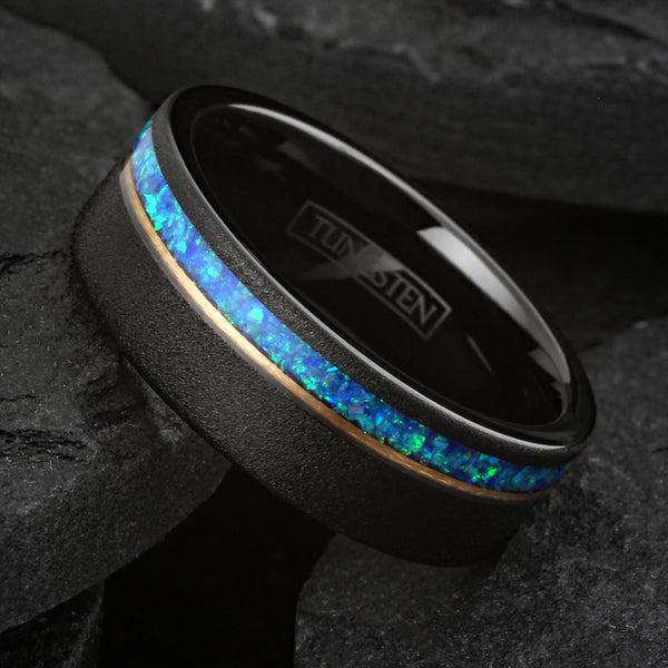 Elegant Brushed Finish Black Flat Band Tungsten Ring with Off-Center Asymmetrical Man-Made Teal Blue Opal Inlay And Rose Gold Stripe.