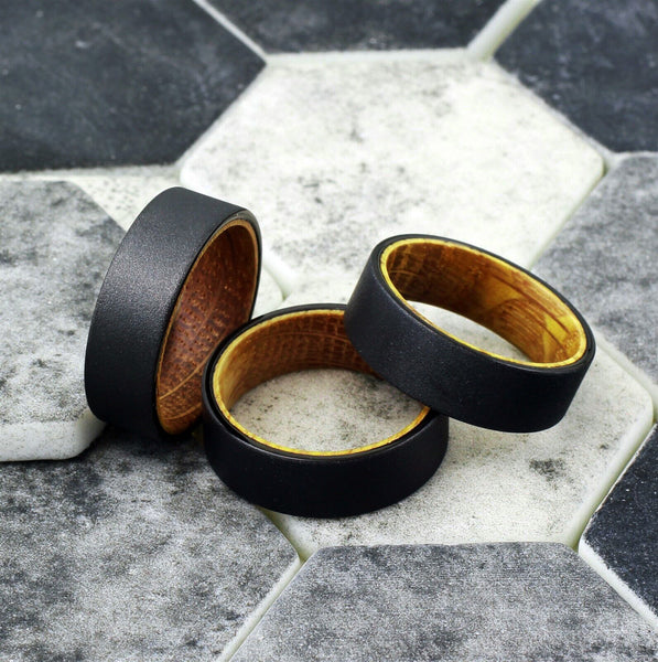 Charming Rough Brushed Distressed Sandblast Finish Flat Band Black Tungsten Ring with Whiskey Barrel Oak Wood Inner Band Sleeve.
