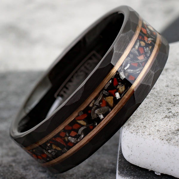 Spectacular Faceted Brushed Finish Black Tungsten Flat Band Ring with Crushed Faux Dinosaur Bone and Black Faux Meteorite Inlay between Rose Gold Stripes.