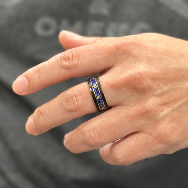 Spectacular Faceted Brushed Finish Black Tungsten Flat Band Ring with Gold Leaf and Crushed Faux Blue Sapphire Inlay between Rose Gold Stripes.