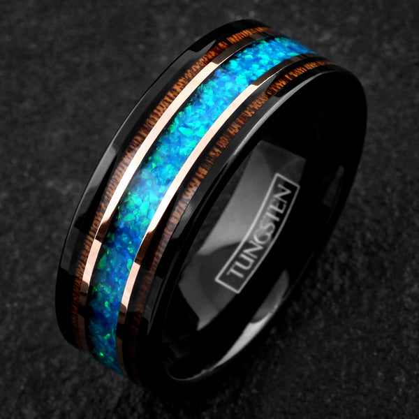 Beautiful Polished Black Tungsten Flat Band Ring with Iridescent Man-Made Crushed Hawaii Blue Opal Inlay Between Two Rose Bands Surrounded By Koa Wood Inlays.