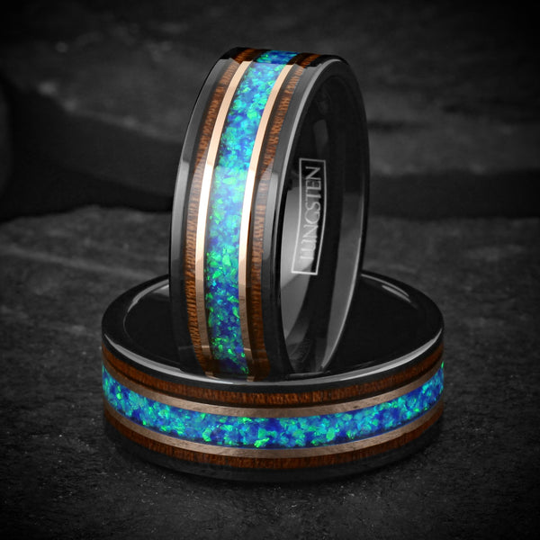 Beautiful Polished Black Tungsten Flat Band Ring with Iridescent Man-Made Crushed Hawaii Blue Opal Inlay Between Two Rose Bands Surrounded By Koa Wood Inlays.