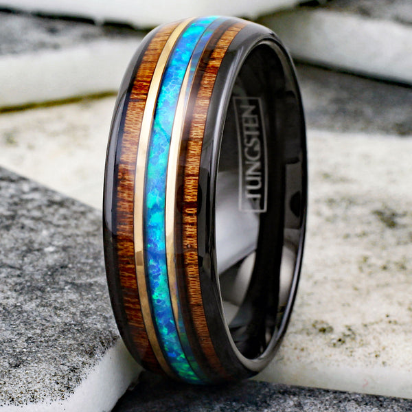 Gorgeous Polished Black Tungsten Low Dome Band Ring with Iridescent Man-Made Crushed Hawaii Blue Opal Inlay Between Two Rose Bands Surrounded By Koa Wood Inlays.