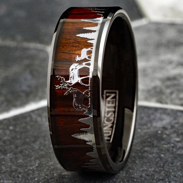 Beautiful Polished Finish Black Flat Band Tungsten Ring With Silver Deer Family In Forest Scene Overlay On Wood Inlay.