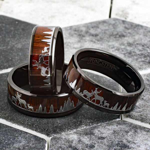 Beautiful Polished Finish Black Flat Band Tungsten Ring With Silver Deer Family In Forest Scene Overlay On Wood Inlay.