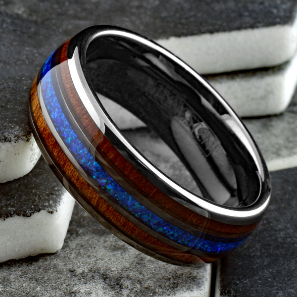 Stunning Polished Gunmetal Gray Tungsten Low Dome Ring with Iridescent Man-Made Crushed Hawaii Blue Opal Inlay Between Two Koa Wood Inlays.