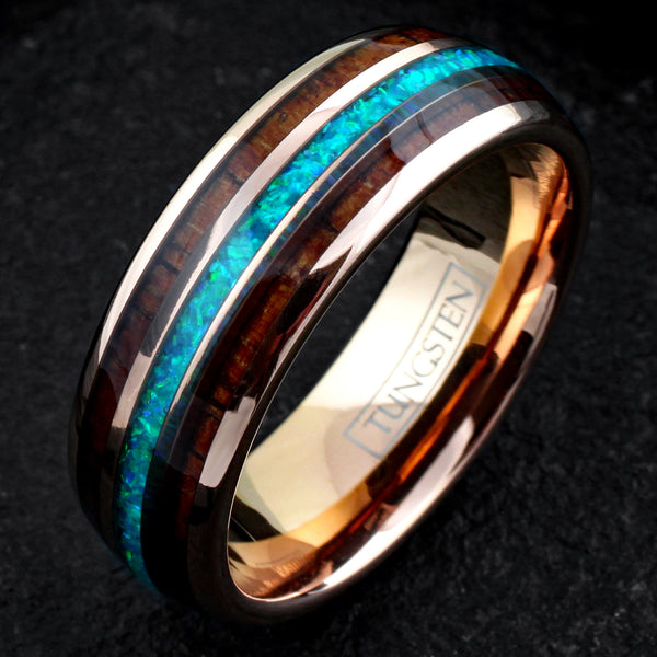 Dazzling Polished Rose Gold Tungsten Low Dome Band Ring with Iridescent Man-Made Crushed Hawaii Blue Opal Inlay Between Two Koa Wood Inlays.