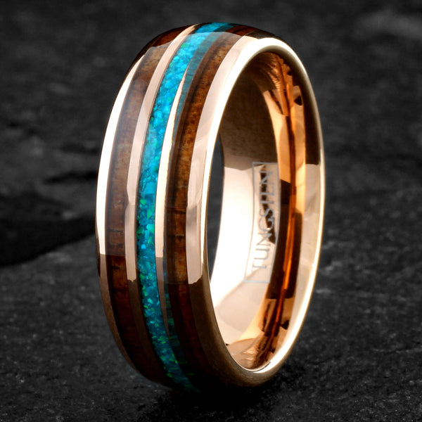 Dazzling Polished Rose Gold Tungsten Low Dome Band Ring with Iridescent Man-Made Crushed Hawaii Blue Opal Inlay Between Two Koa Wood Inlays.