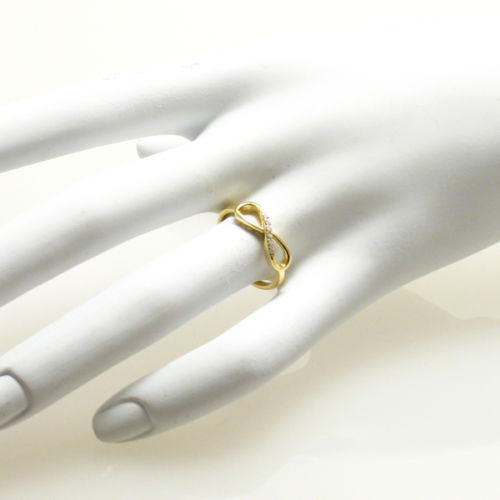 Graceful 14K gold plated infinity ring with CZ sparkle | Wholesale sterling silver rings - Jewelry | Hand photo