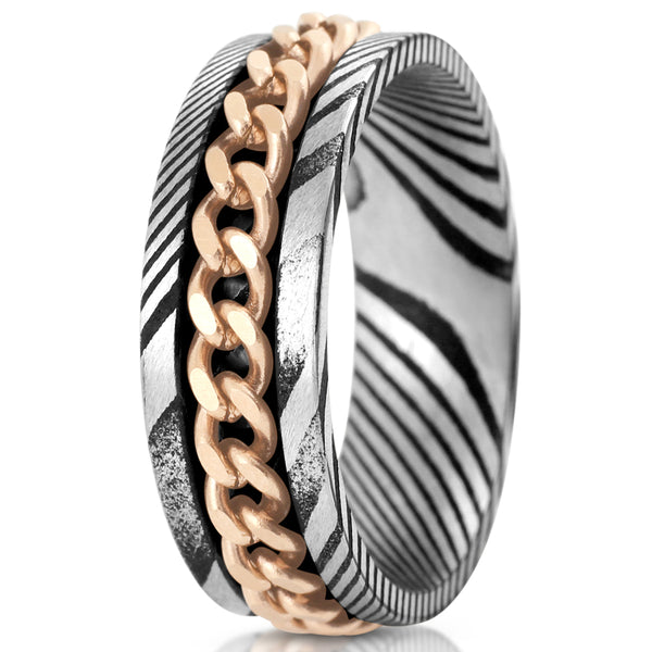 Antiqued black & silver Damascus Steel band ring w/ rose gold Cuban chain inlay | White upright  photo