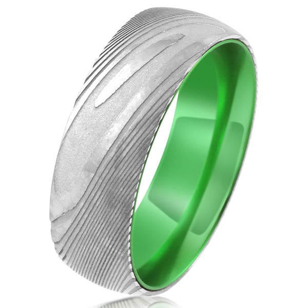 Damascus steel band ring w/ lime green anodized aluminum inner band sleeve | Tilted photo