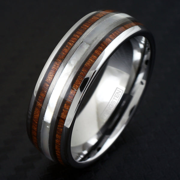 Polished silver tungsten carbide low dome ring w/ mother-of-pearl & Koa wood inlays | Black tilted photo