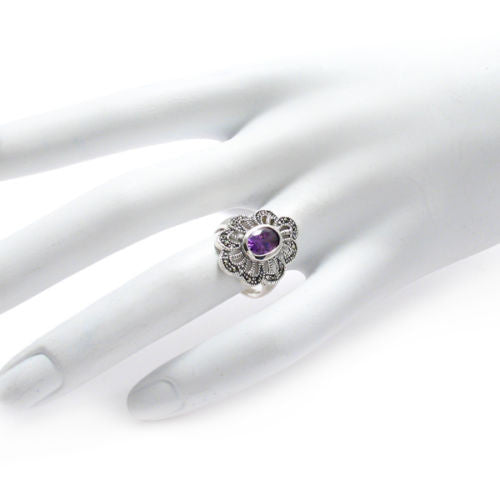 Marcasite flower ring with light purple CZ. Wholesale sterling silver rings. Hand photo.