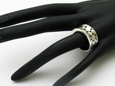 Beautiful and unique concave center pebble in stream ring. Wholesale sterling silver rings. On hand.