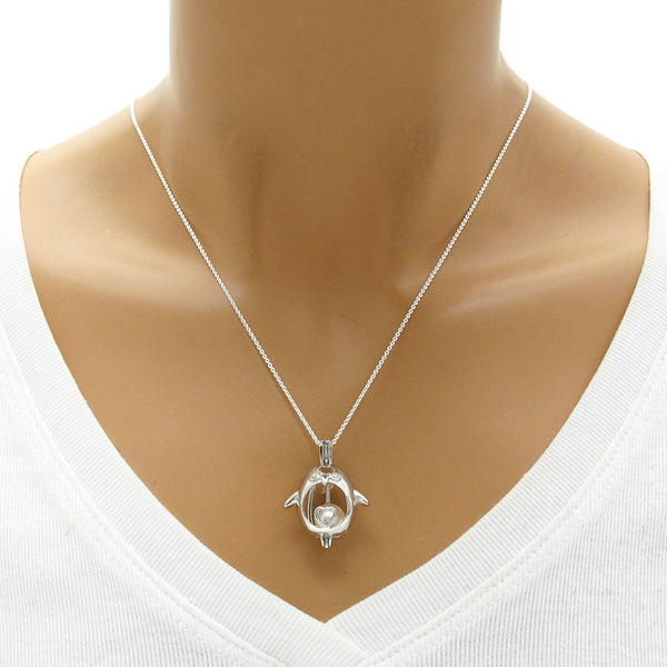 Adorable sterling silver waddling penguin pearl cage pendant | Wholesale 925 sterling silver jewelry | Mannequin photo