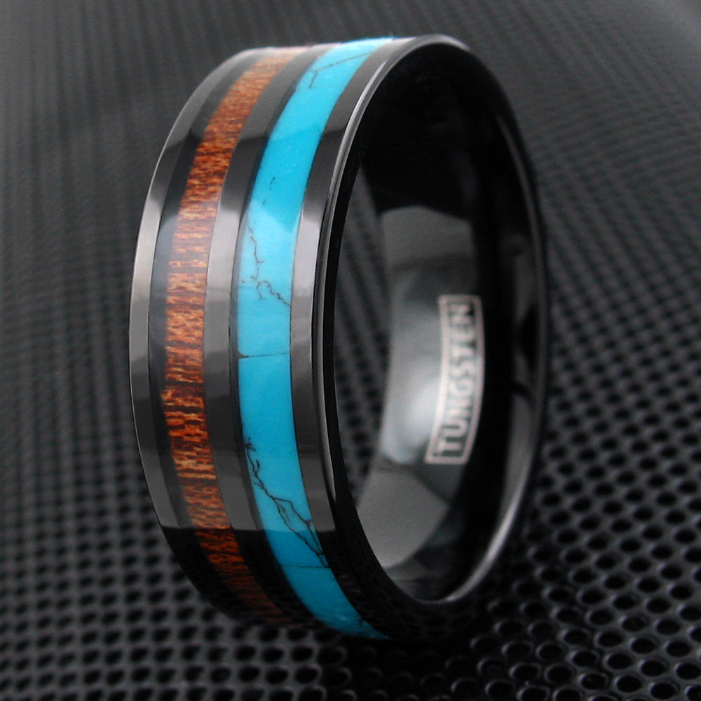beautiful black flat band tungsten ring with classy turquoise inlay next to cool koa wood inlay wholesale tungsten rings wedding bands black background photo