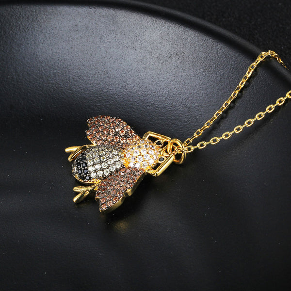 Awesome Black, White, & Champagne CZ Encrusted Fly Necklace in 14K Gold Plated Brass.