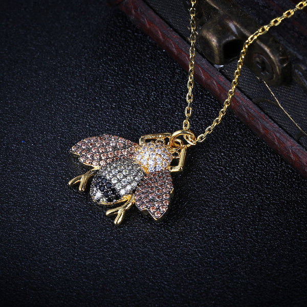 Awesome Black, White, & Champagne CZ Encrusted Fly Necklace in 14K Gold Plated Brass.