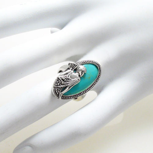 Flapper with fan in turquoise and silver. Wholesale sterling silver rings. Hand photo.