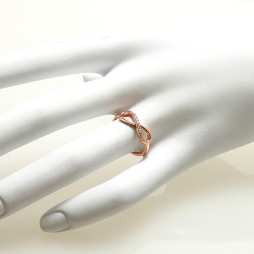 Graceful rose gold plated infinity ring with CZ sparkle | Wholesale sterling silver rings - Jewelry | Hand photo