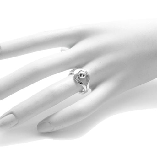 Beautiful ring depicting a ball or bead caught in a loop. Wholesale Sterling Silver Rings. On mannequin photo