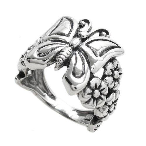 Adorable butterfly sitting on a flower bed waiting to fly away. Wholesale Sterling Silver Rings. Diagonal View