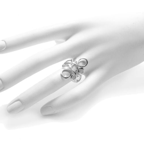 Unusual ring in sterling silver with circular swirly lines. Wholesale Sterling Silver Rings. On mannequin photo.
