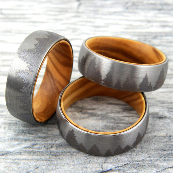 Brushed Finish tungsten carbide band ring w/ etched forest scene & olive wood inner band | Wholesale wedding bands | Marble group photo