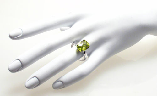Spectacular Ring with Lime / Peridot Colored Rectangular 10x14mm CZ Solitaire in Sterling Silver.