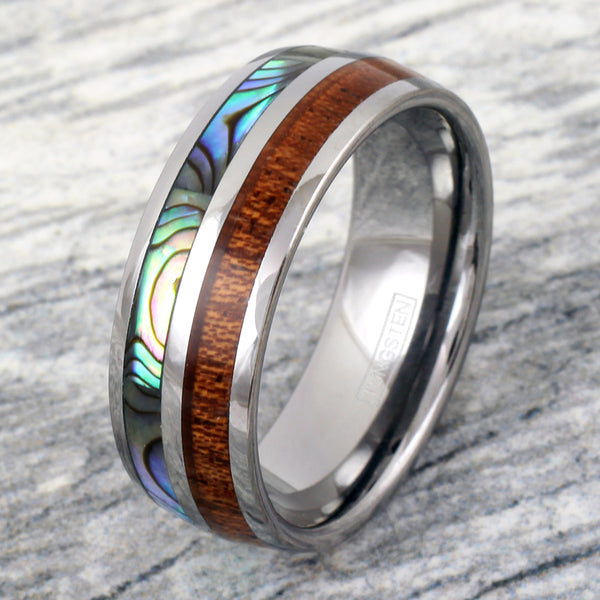 Silver tungsten dome ring w/ Koa wood & Abalone shell inlays | Wholesale tungsten rings- wedding bands | Stone background photo